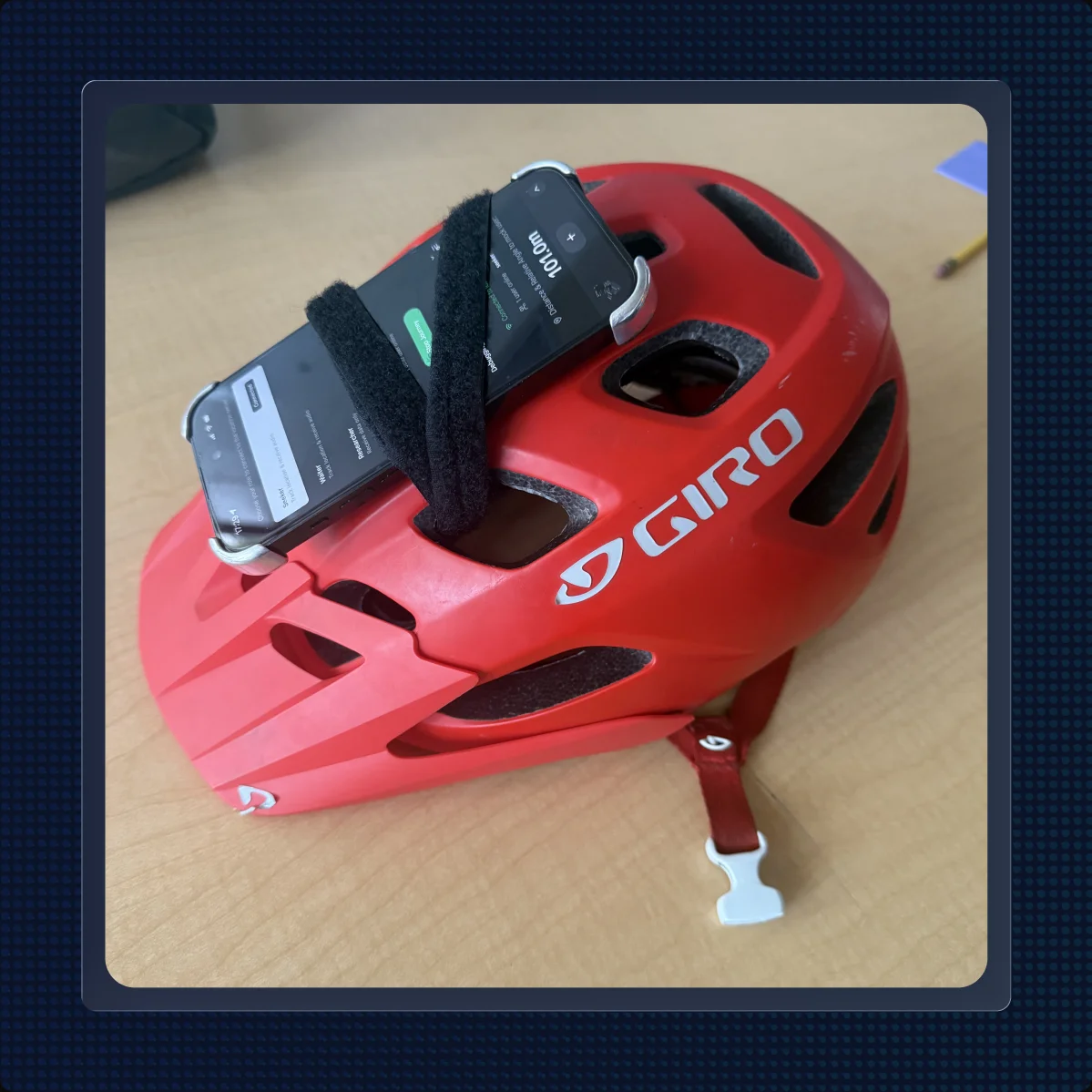 The prototype rig — a phone strapped to a bike helmet, standing in for glasses with a magnetometer